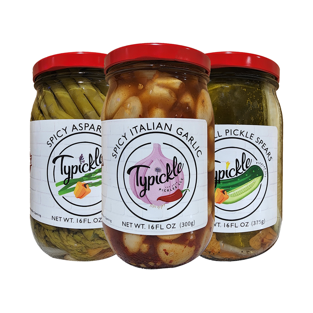 three jars of pickles and pickles on a white background